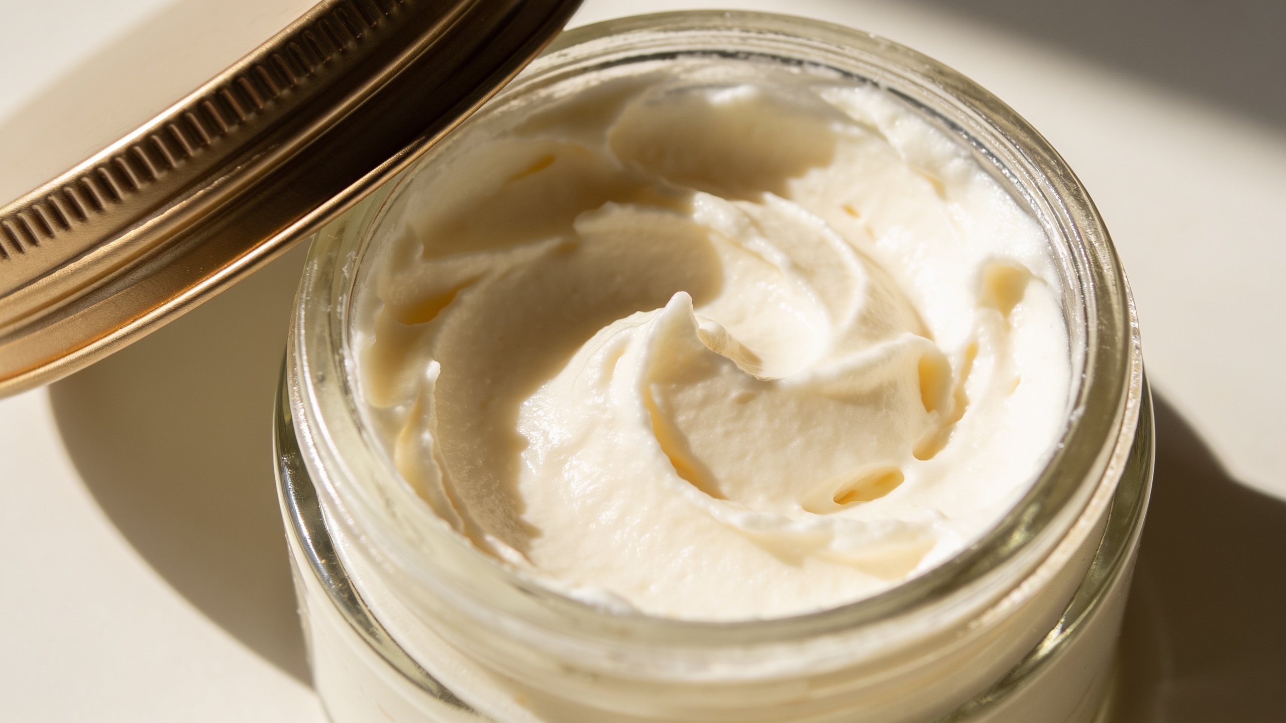 Photo of whipped shea body butter in a jar